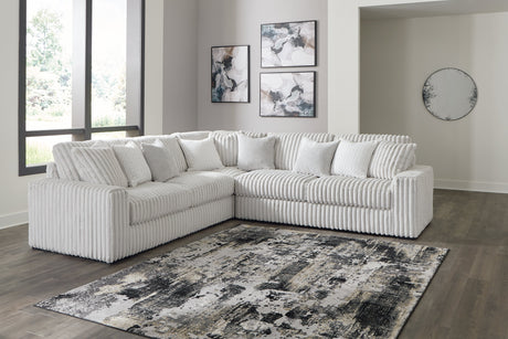 Stupendous 3-Piece Sectional with Ottoman in Alloy by Ashley at Eve Furniture