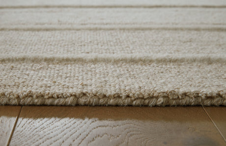 Teelgan Ivory/Tan Extra Large Rug by Ashley at Eve Furniture