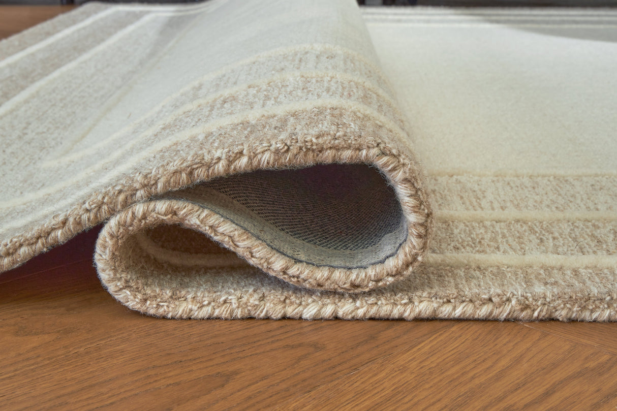 Teelgan Ivory/Tan Extra Large Rug by ASHLEY FURNITURE at Eve Furniture