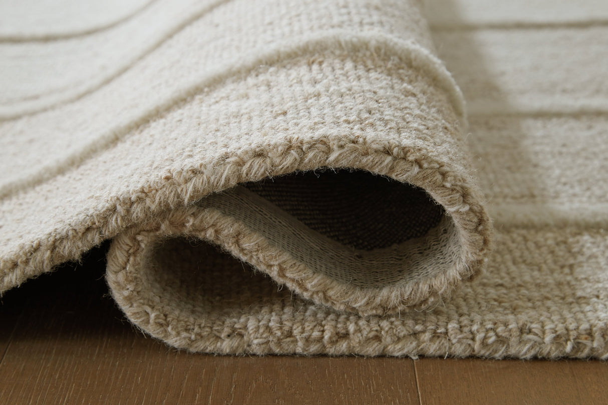 Teelgan Ivory/Tan Extra Large Rug by ASHLEY FURNITURE at Eve Furniture
