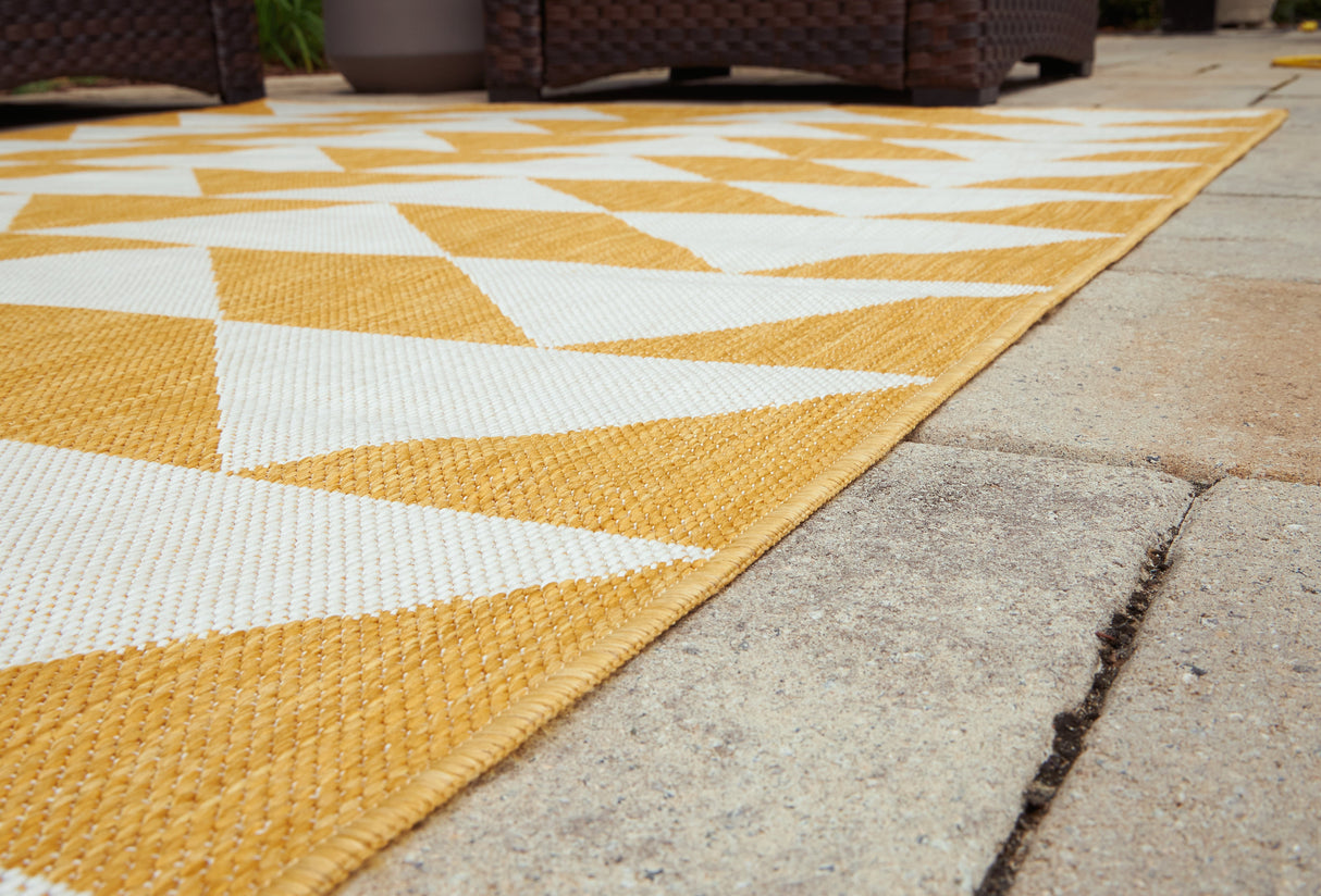 Thomley Ivory/Yellow 5' x 7' Rug by ASHLEY FURNITURE at Eve Furniture