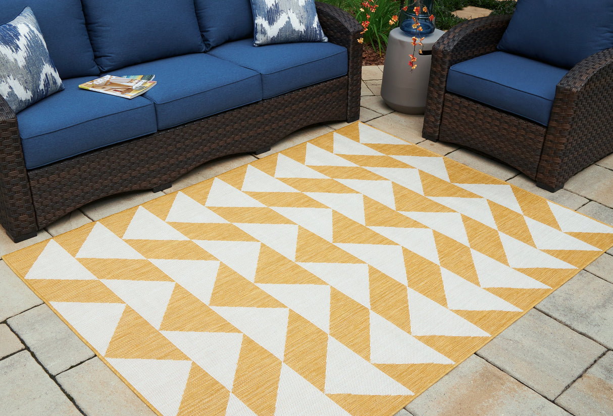 Thomley Ivory/Yellow 5' x 7' Rug by ASHLEY FURNITURE at Eve Furniture