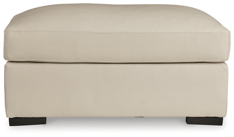 Tresure Trove Almond Ottoman by Ashley at Eve Furniture