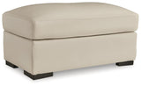 Tresure Trove Almond Ottoman by Ashley at Eve Furniture