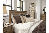 Trinell Brown Queen Panel Bed by Ashley at Eve Furniture