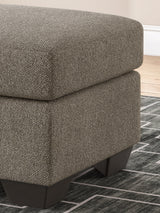 Triston-Peaks Suede Ottoman by Ashley at Eve Furniture