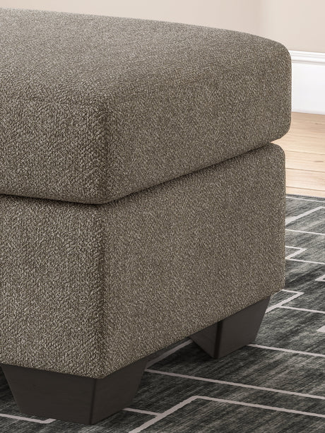 Triston-Peaks Suede Ottoman by Ashley at Eve Furniture