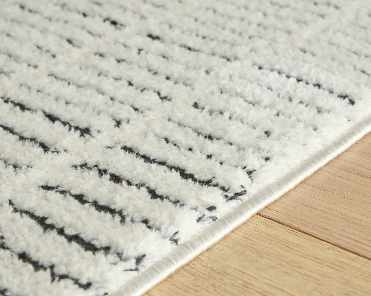 Turinwith Ivory/Black Large Rug by Ashley at Eve Furniture