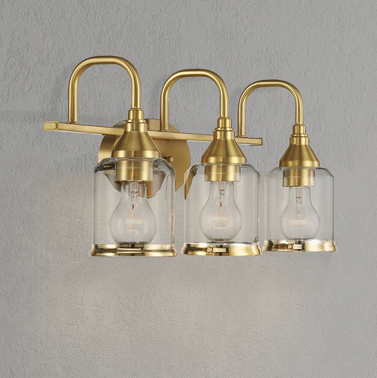 Twilight Three Lights Brushed Gold Contemporary Vanity Light 22"W × 10"H × 7.48"E with Clear Glass by Ashcroft Furniture at Eve Furniture