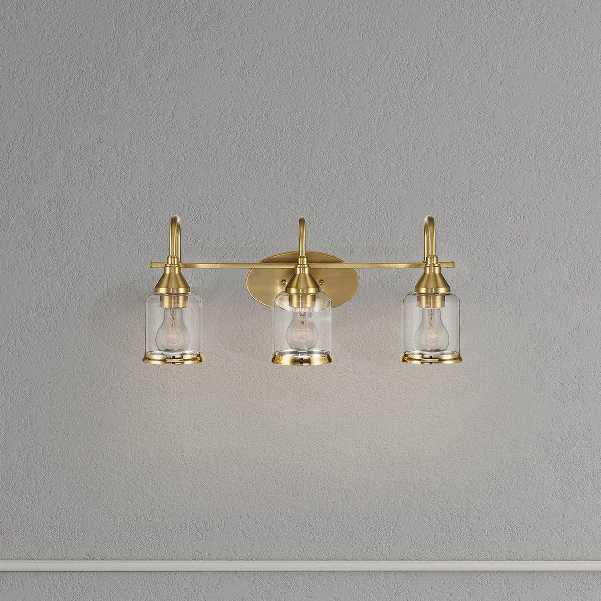 Twilight Three Lights Brushed Gold Contemporary Vanity Light 22"W × 10"H × 7.48"E with Clear Glass by Ashcroft Furniture at Eve Furniture