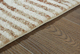 Uduak Cream/Tan/Rust Large Rug by Ashley at Eve Furniture