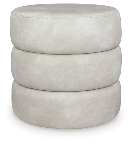 Ummi Bone Swivel Accent Ottoman by Ashley at Eve Furniture