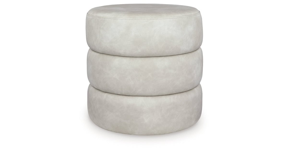 Ummi Bone Swivel Accent Ottoman by Ashley at Eve Furniture