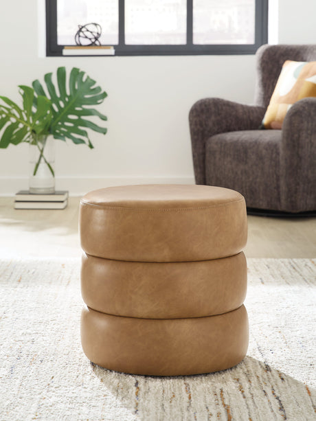 Ummi Caramel Swivel Accent Ottoman by Ashley at Eve Furniture