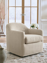 Valwick Cream/Brown Swivel Accent Chair by Ashley at Eve Furniture