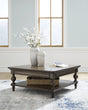 Veramond Dark Brown Coffee Table by Ashley at Eve Furniture