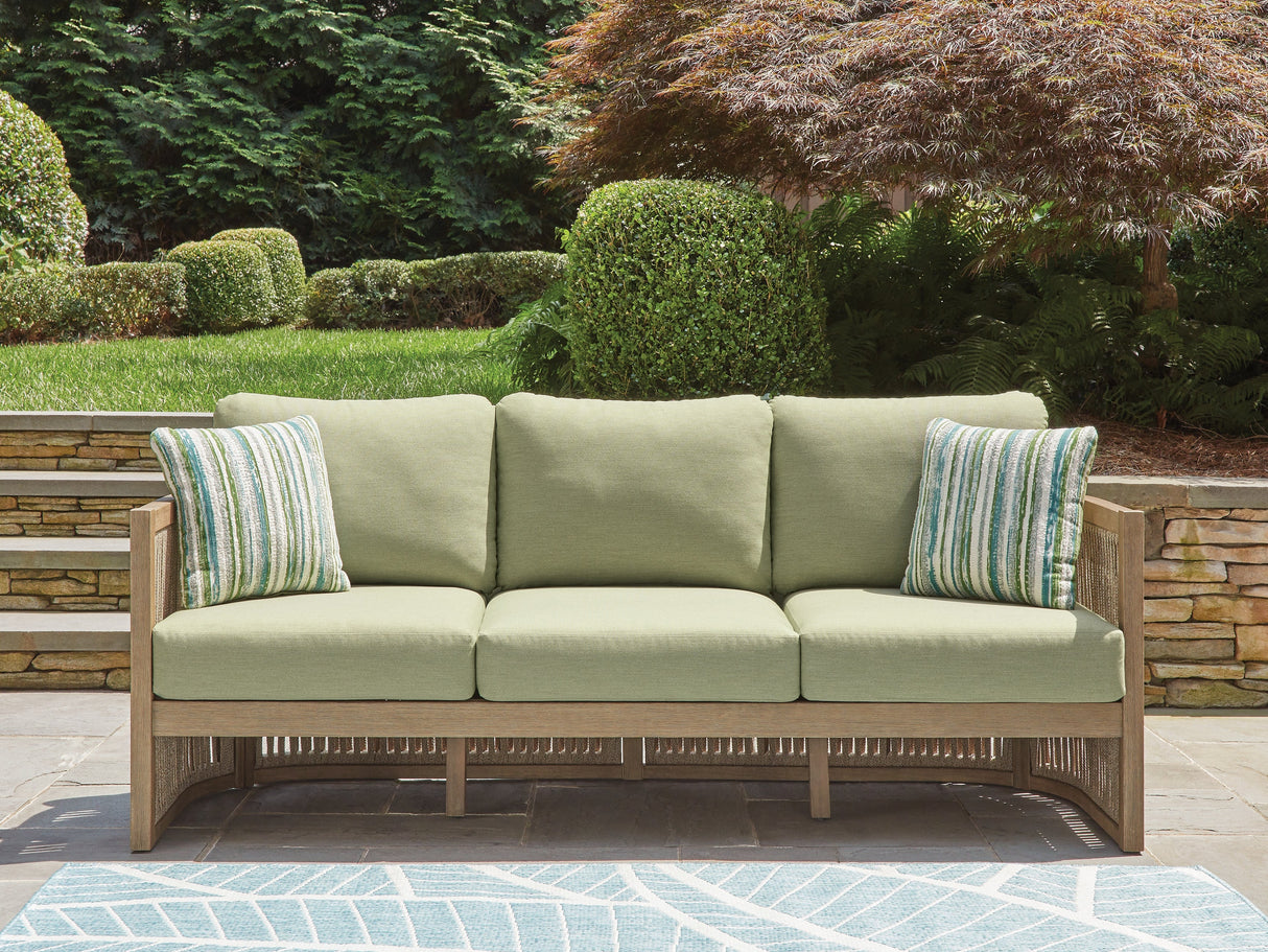 Vision Lane Beige/Green Outdoor Sofa with Cushion by Ashley at Eve Furniture