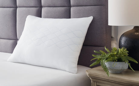 White Comfort Pillow by Ashley at Eve Furniture