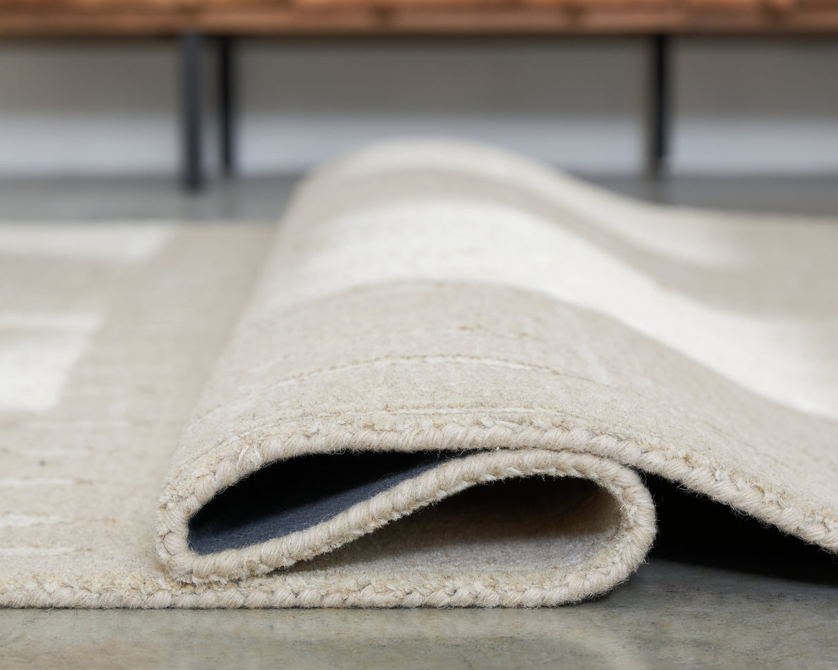 Wolbert Tan/Ivory Large Rug by Ashley at Eve Furniture