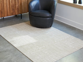 Wolbert Tan/Ivory Medium Rug by Ashley at Eve Furniture