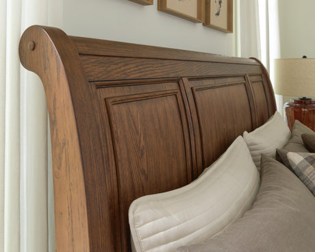 Zackaryn Warm Brown Queen Sleigh Storage Bed by Ashley at Eve Furniture