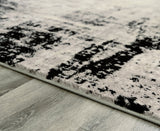 Zekeman Black/Cream/Gray Medium Rug by Ashley at Eve Furniture
