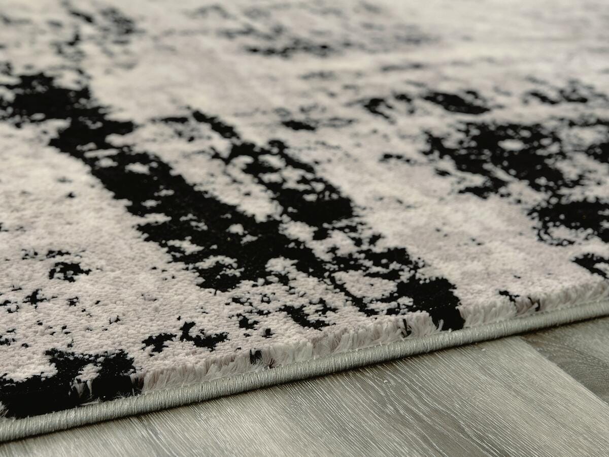 Zekeman Black/Cream/Gray Medium Rug by Ashley at Eve Furniture