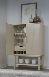 Zinnia Two Door Ash Wood Bar Cabinet in White Sand by Modus Furniture at Eve Furniture