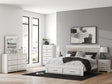 Zuraleus White Upholstered Storage Panel Bedroom Set with 2 Footboard Drawers by Ashley at Eve Furniture